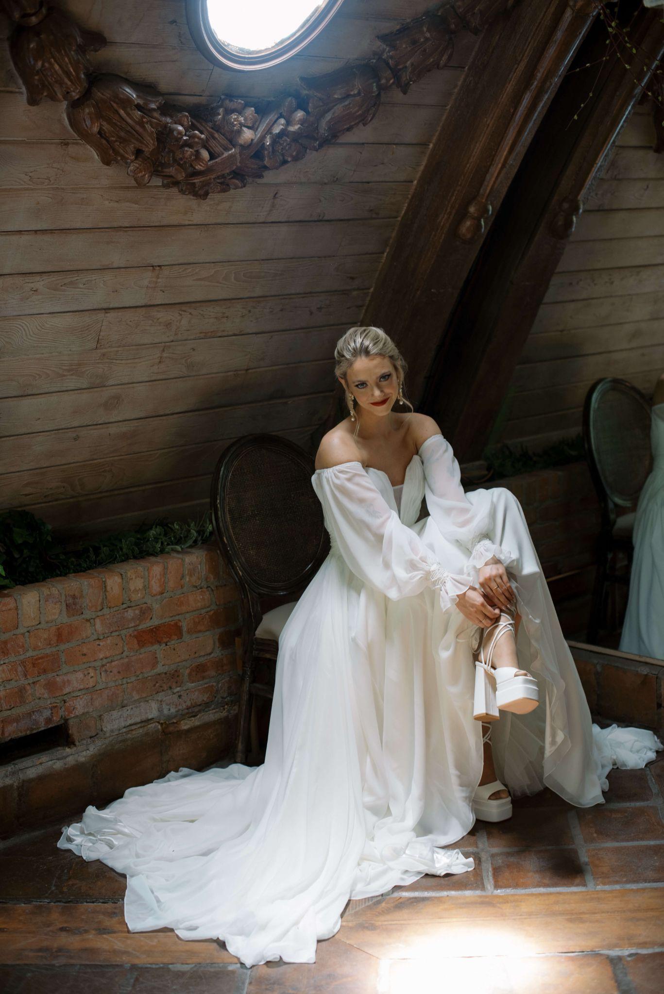 VA Bridal modest wedding dress with flowy skirt