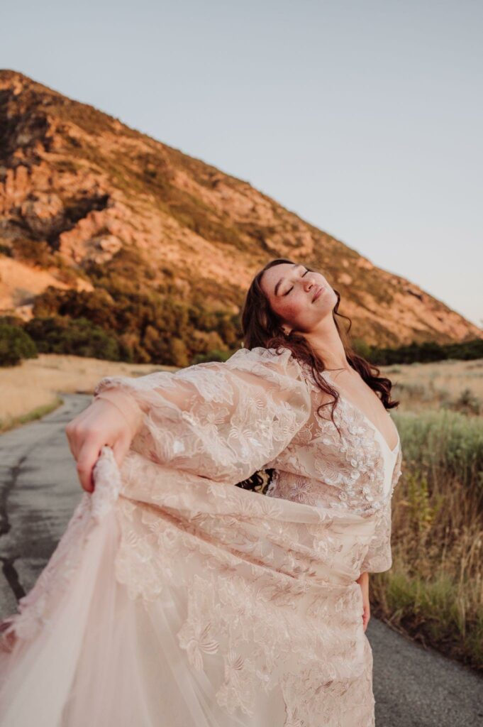 bride in her custom gown from VA Bridal appreciating nature