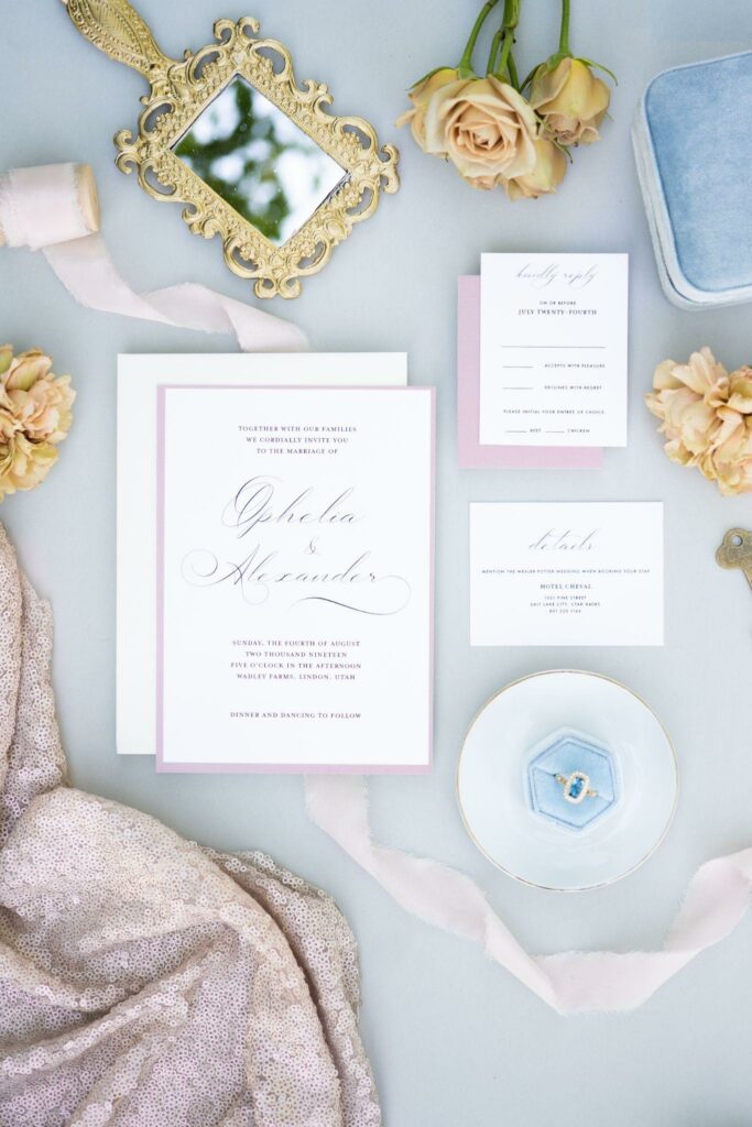 photo of a some wedding accessories laid against the baby blue surface
