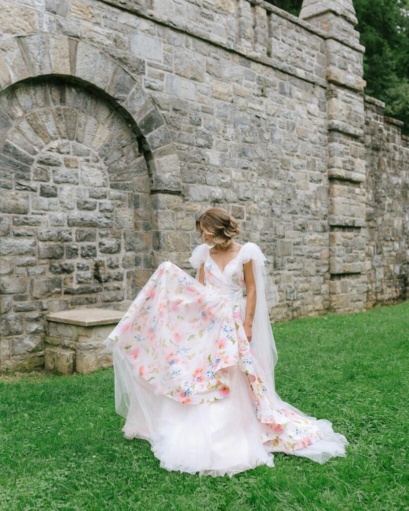 a woman wearing a beautiful, floral wedding dress