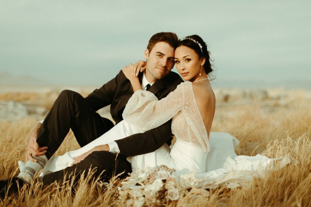 a groom and bride wedding photo in a field