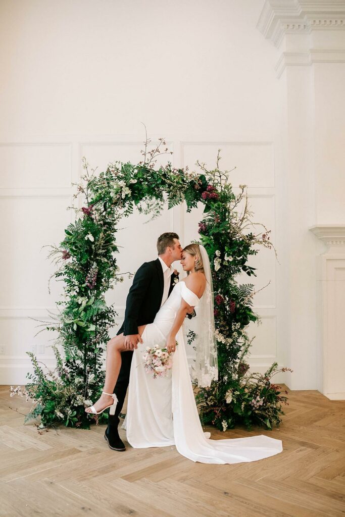 a bride and groom posing for a photo