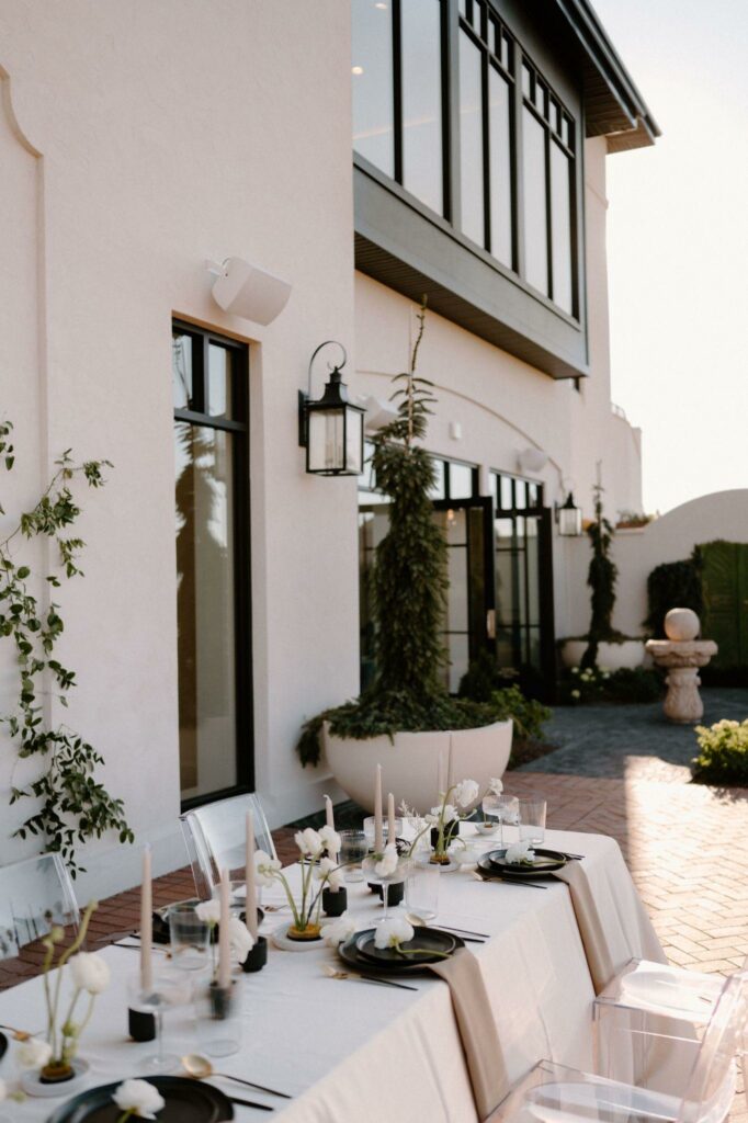 a fancy vouge-themed wedding showing a long table