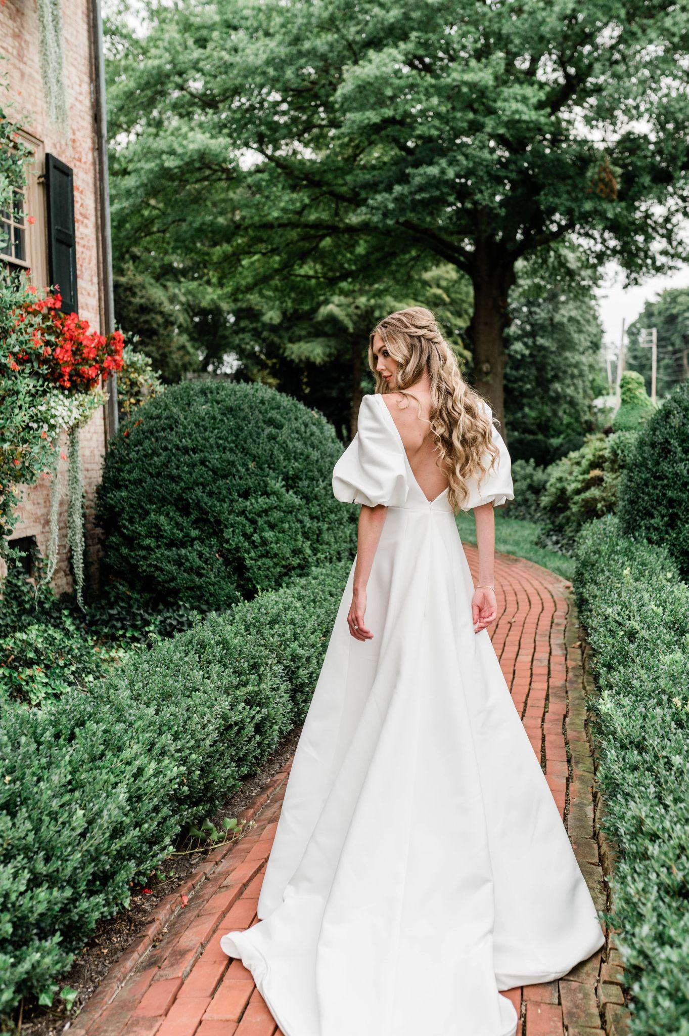 the Parker simple wedding dress with low back and puff sleeves
