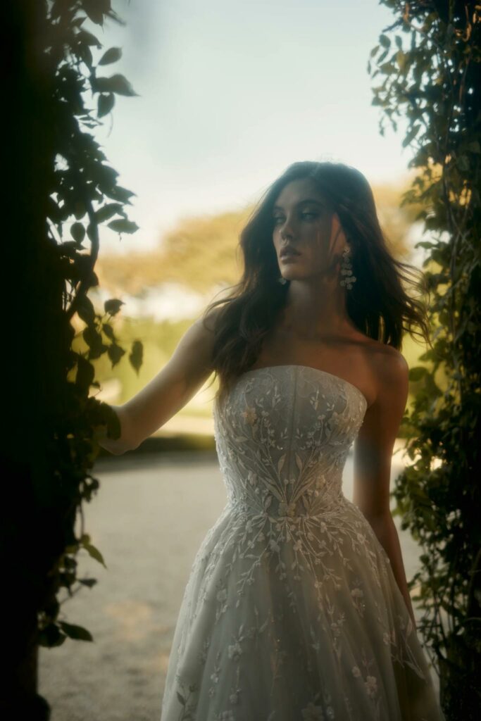 a woman wearing Enaura Bridal wedding gown with intricate beadwork