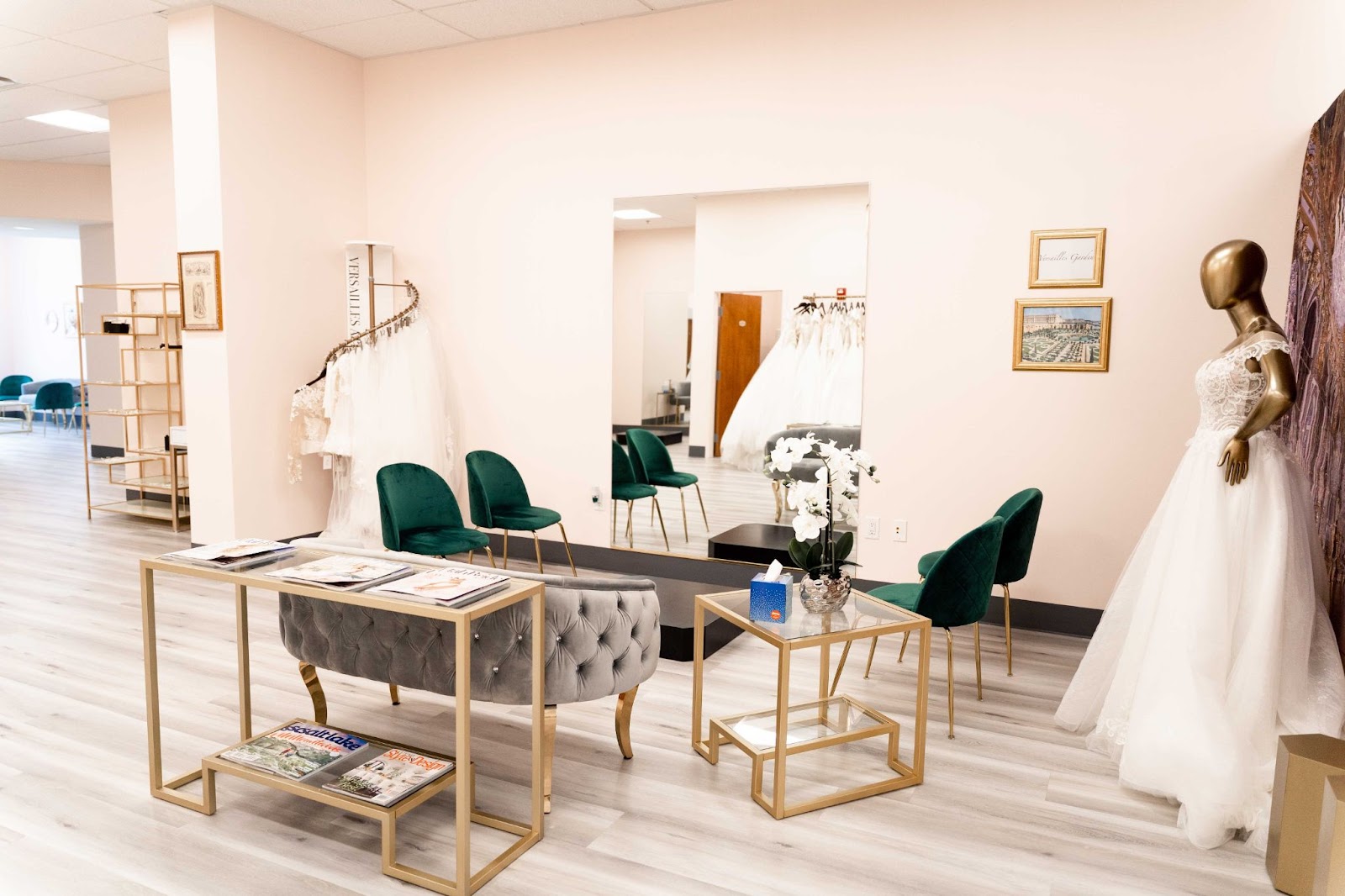 A bridal salon scene with a lovely wedding dress hanging on the wall